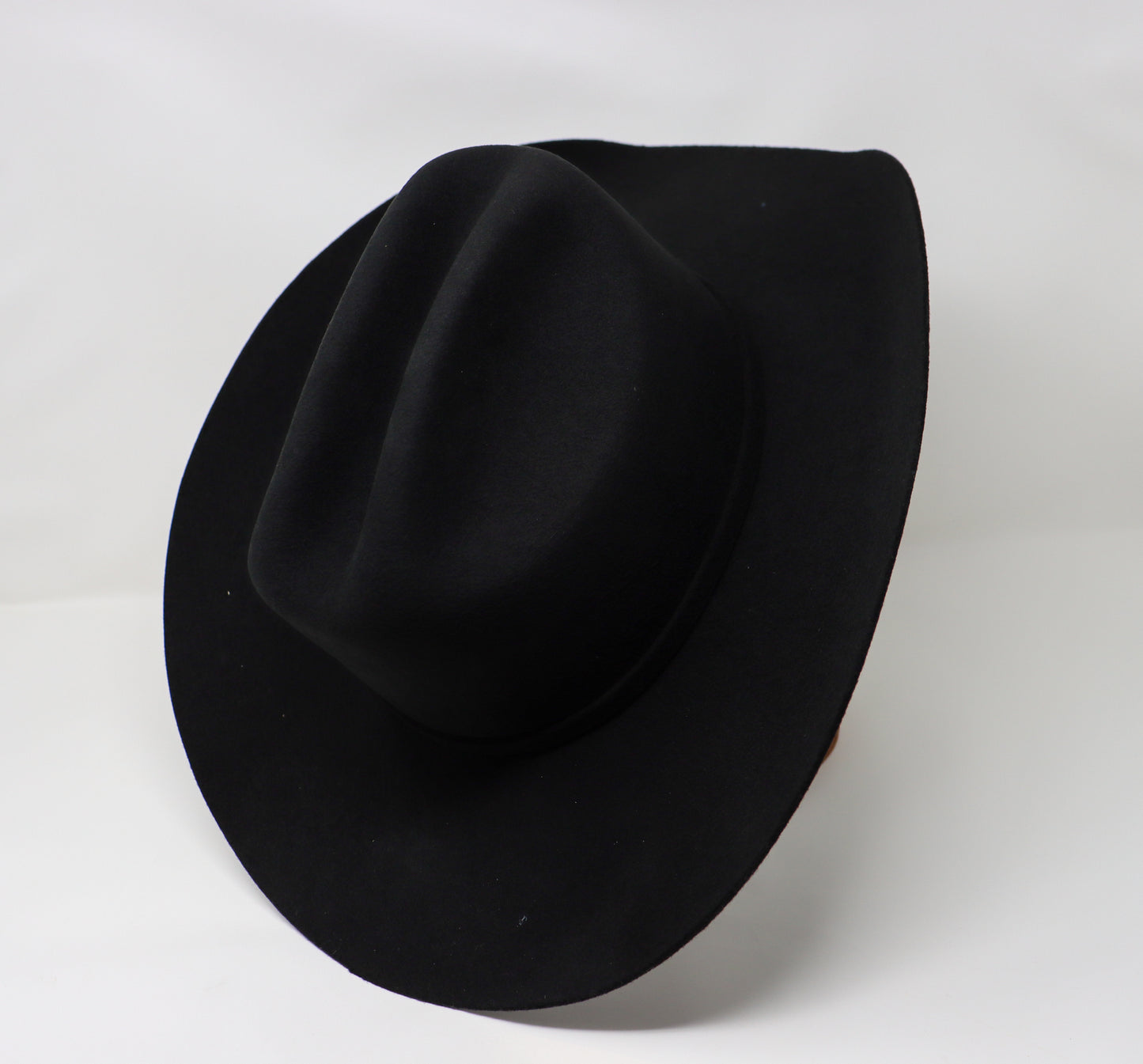 Black fedora hat on a white background